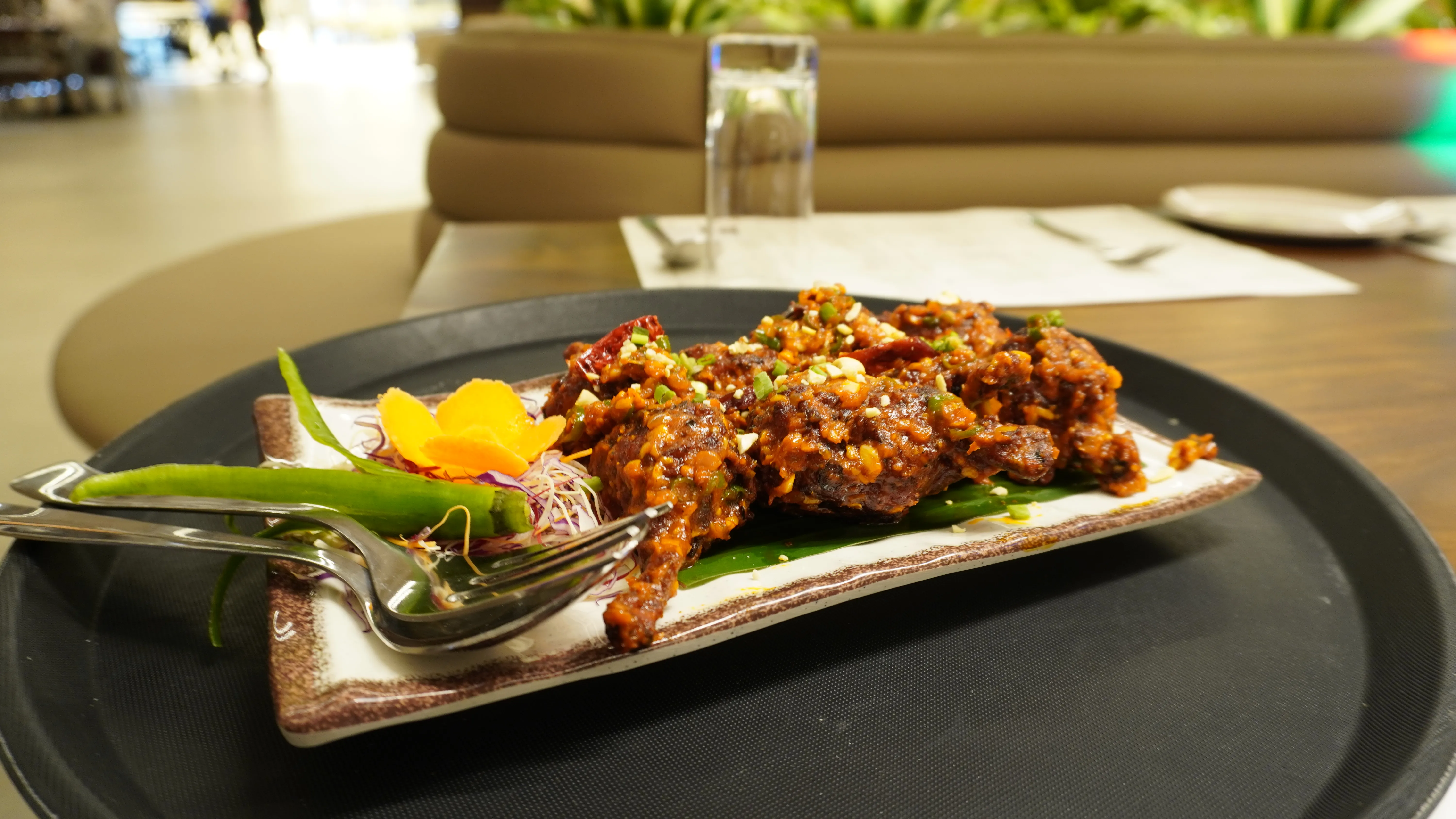 Horizontal image of a desert landscape with sand dunes and a bright blue sky