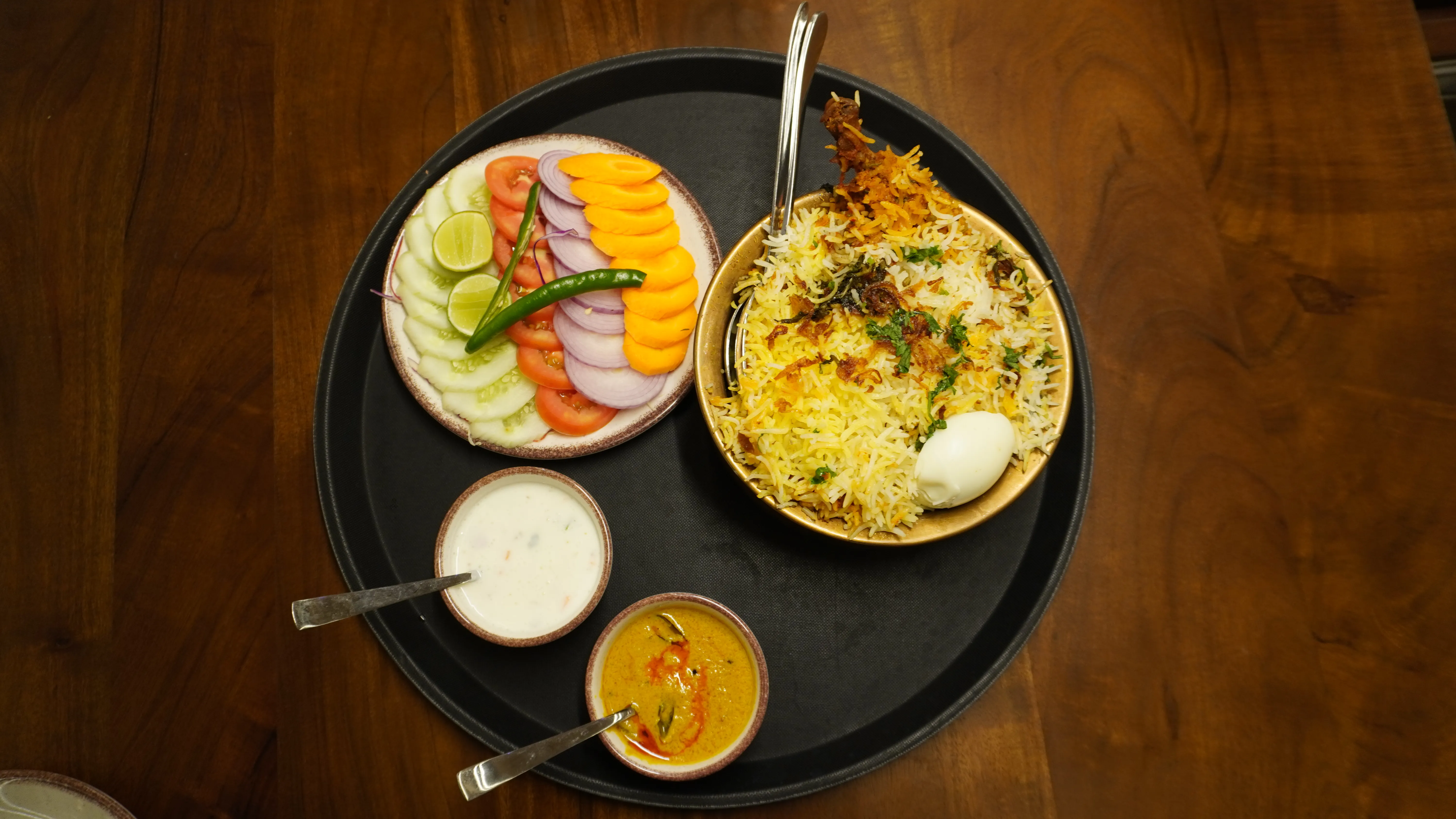 Horizontal image of a city skyline at night with illuminated skyscrapers