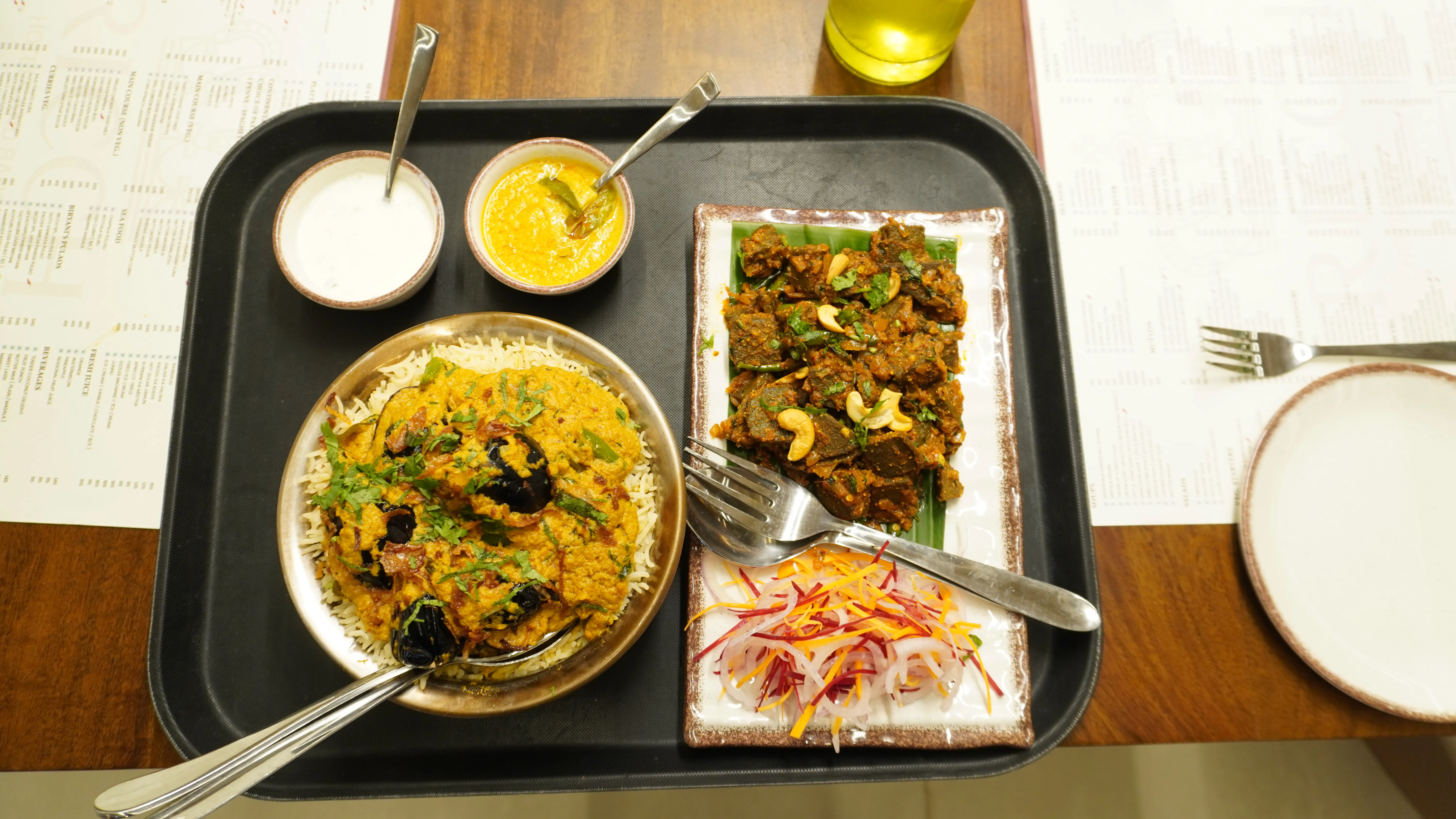 Horizontal image of a desert landscape with sand dunes and a bright blue sky