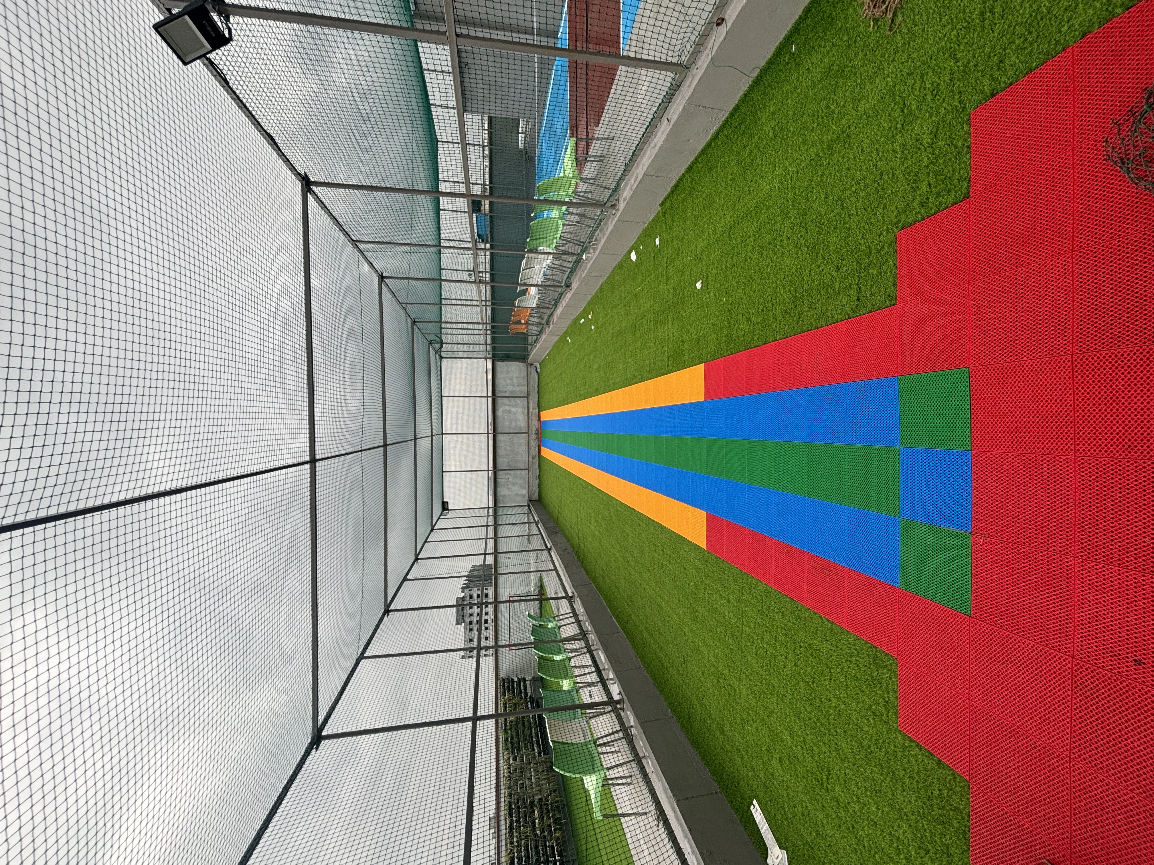 Outdoor patio seating with string lights and greenery for a relaxed dining experience